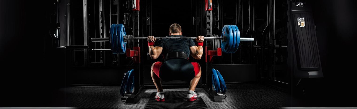 Men Performing Squatting with a Weightlifting Belt | HustlersOnlyUK