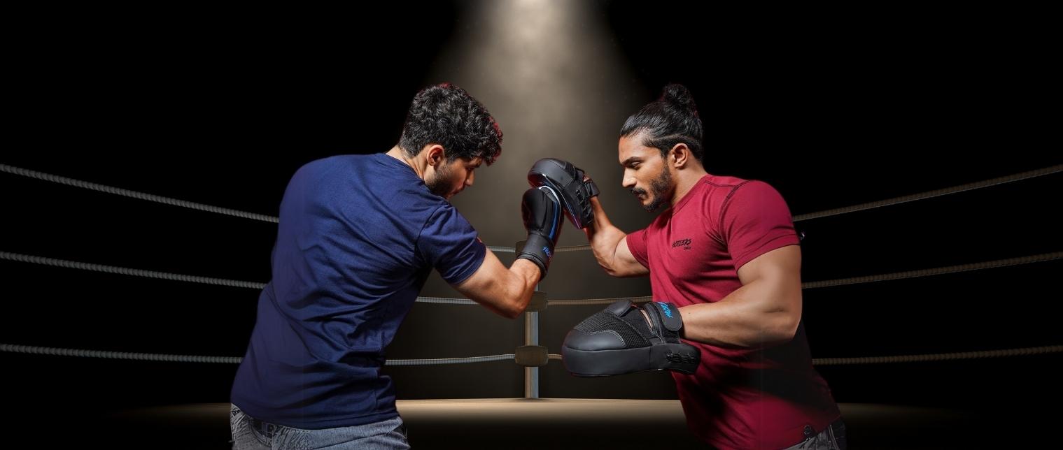 Boxer and trainer training with Hustlers Only UK's Boxing Focus Pads